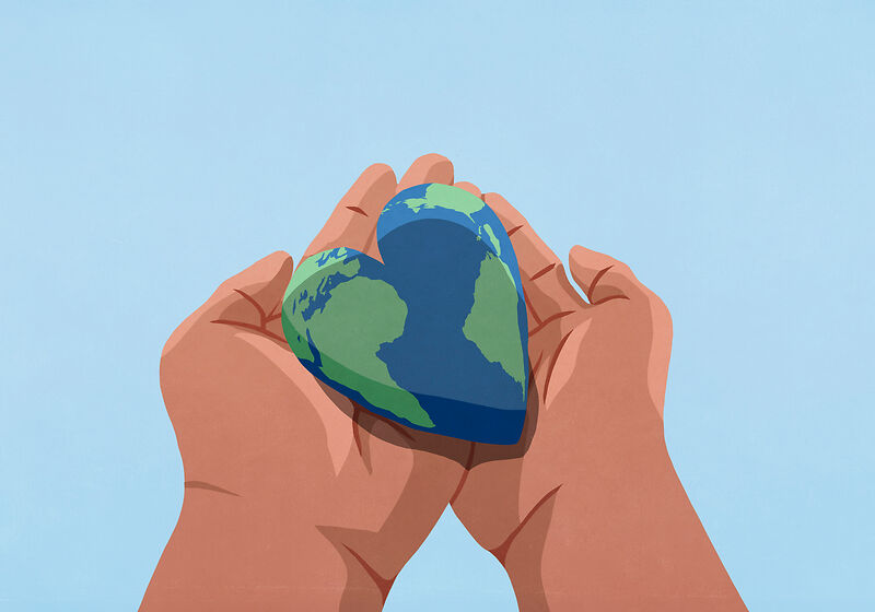 Hände die die Erde in Form eines Herzens halten